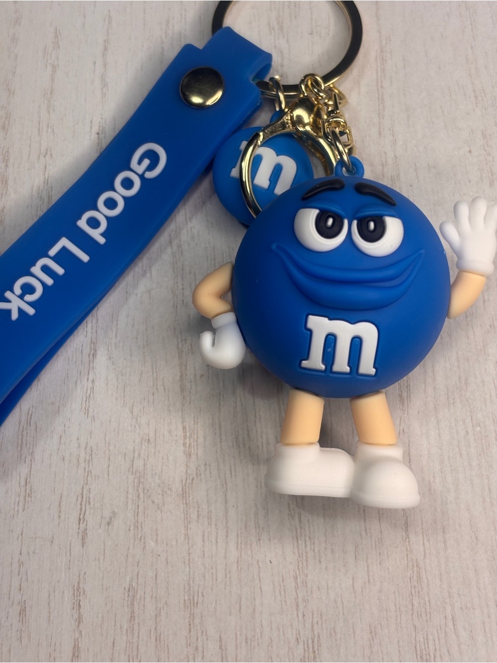 Blue M&M Character Keychain with 'Good Luck' Strap